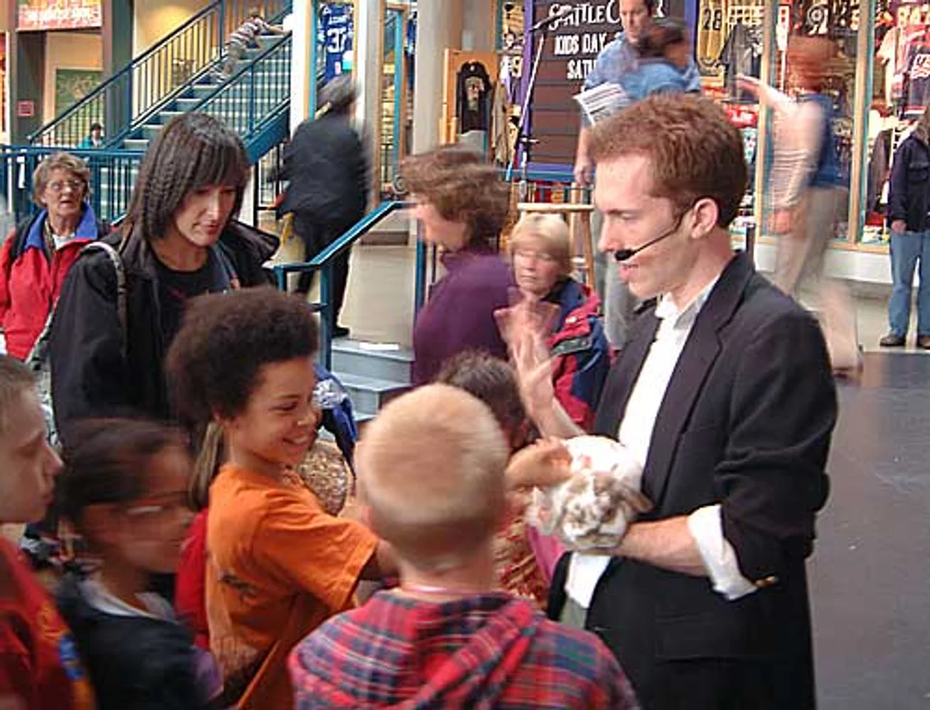 Jacob performing close-up for a seated audience