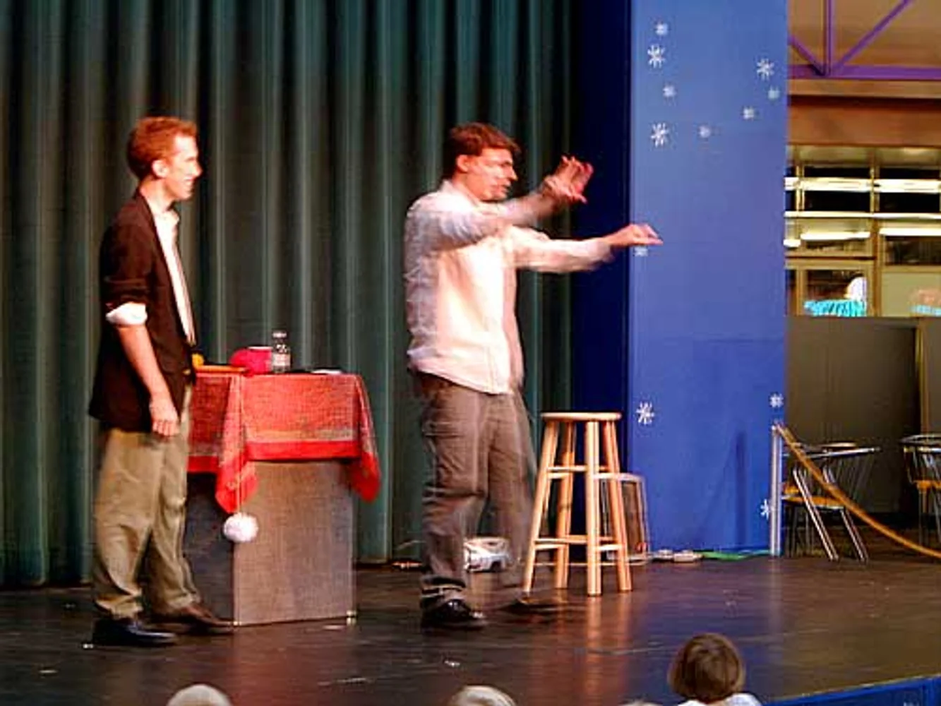 Stage magic with a young audience volunteer
