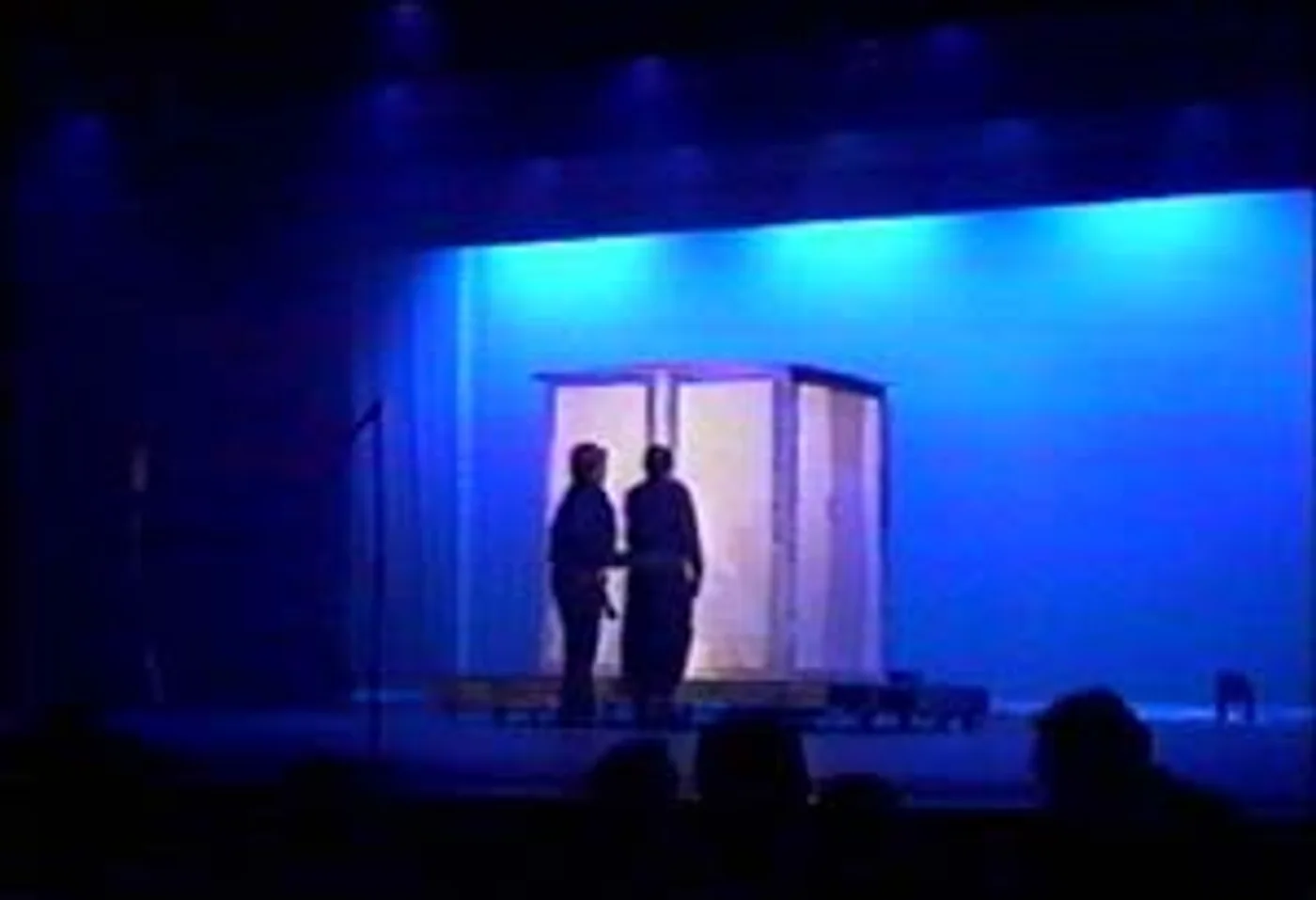 Assistants closing the mysterious shadow box