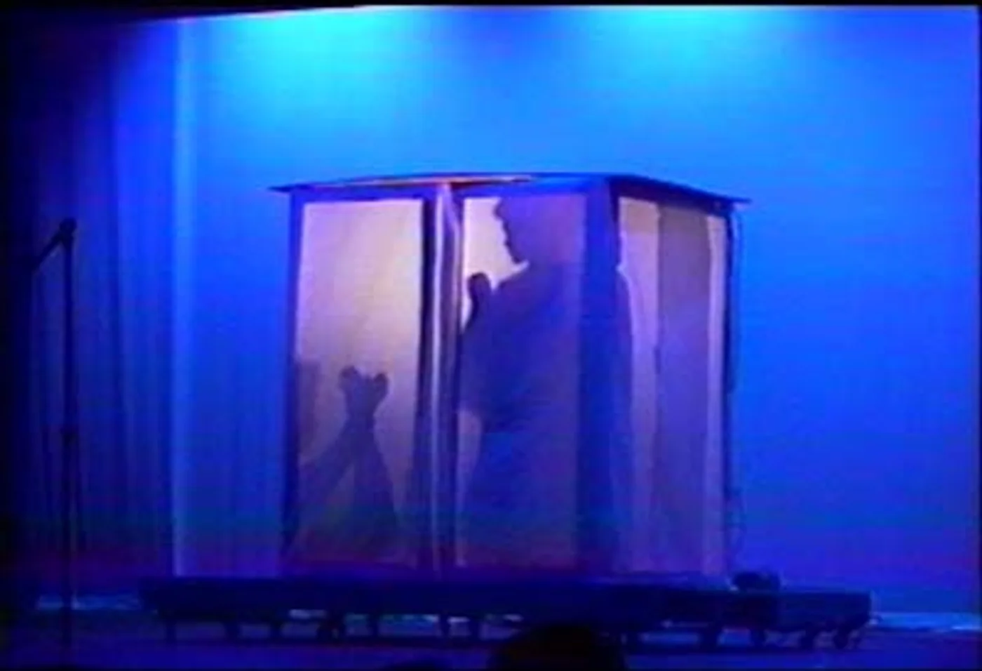 Figures taking shape inside the illuminated shadow box